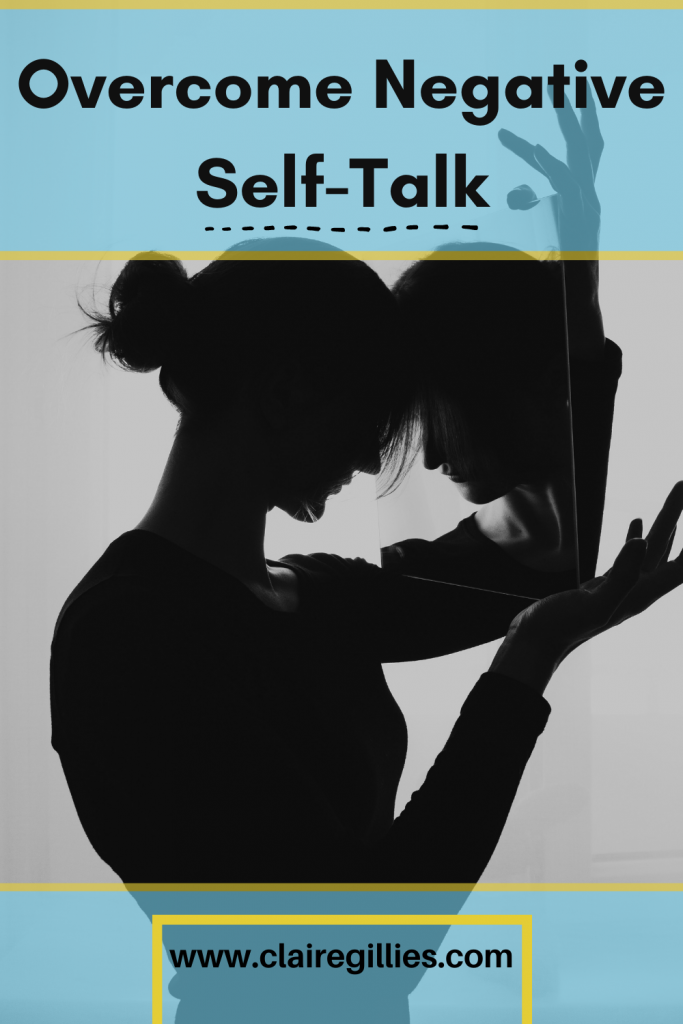 woman looking in mirror. Over come negative self talk, claire gillies blog