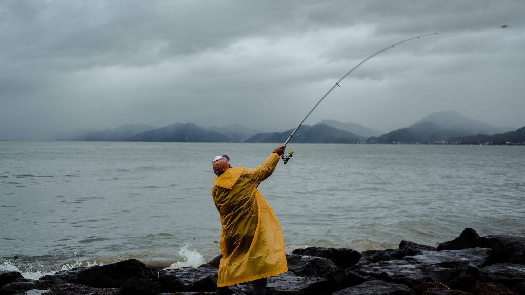 yellow raincoat fishing rod.