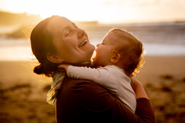 woman with child. Are You Lacking Optimism? How To Shift Your Mindset Right Now